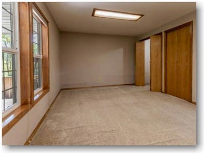 Carpet installed in basement over concrete with wrinkles