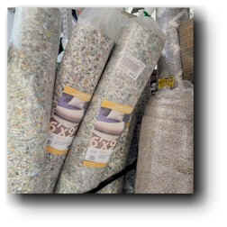 Small rolls of Rebond Carpet Padding for sale at a local home improvement warehouse. 